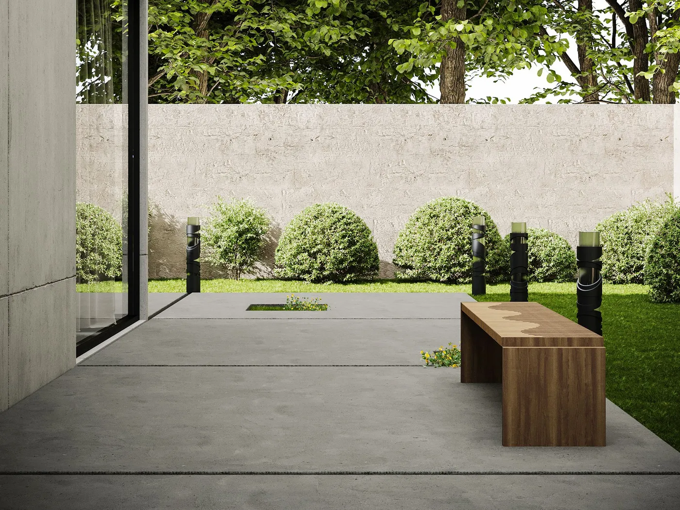 A poured concrete patio slab running along a house beside a lawn